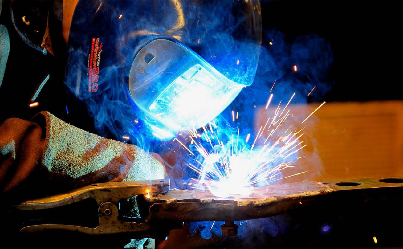 Welding with torch and mask